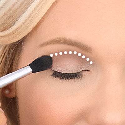 Wipe brush clean & apply a darker eyeshadow into socket