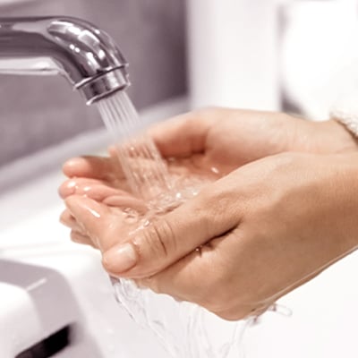 Pour it under warm running water & allow salts to disperse